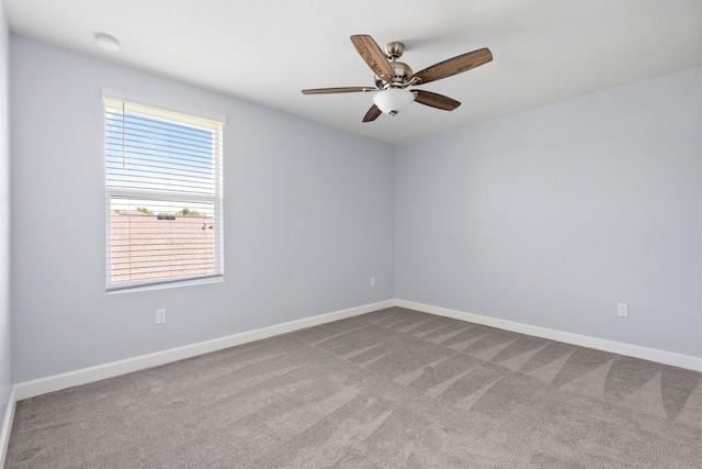 852 Gairloch Ln, Fort Pierce, FL 34947 - spare room featuring carpet floors, a smoke detector, baseboards, and a ceiling fan