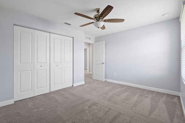 852 Gairloch Ln, Fort Pierce, FL 34947 - unfurnished bedroom with a closet, carpet flooring, baseboards, and a ceiling fan