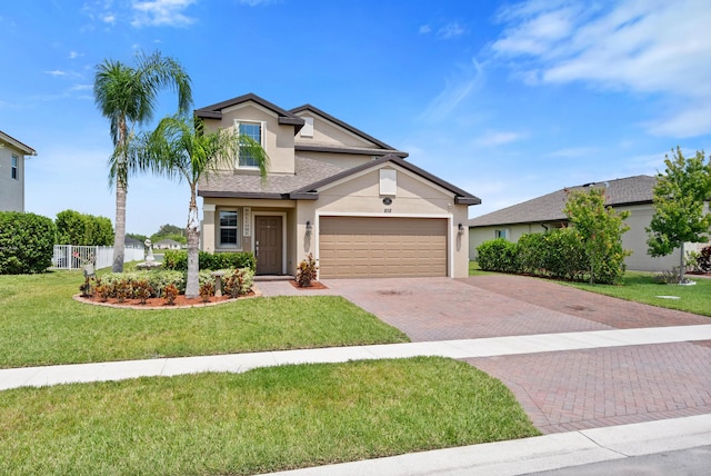 852 Gairloch Ln, Fort Pierce, FL 34947 - traditional home featuring stucco siding, decorative driveway, an attached garage, and a shingled roof