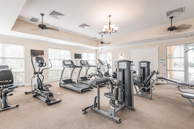 852 Gairloch Ln, Fort Pierce, FL 34947 - exercise room with a raised ceiling, ceiling fan, crown molding, and a chandelier