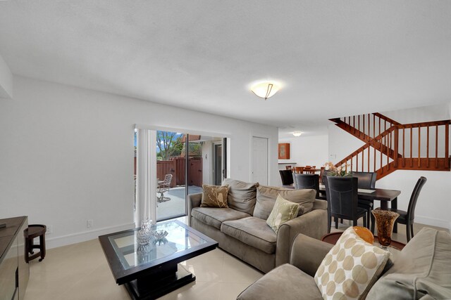 2938 SW 12th St, Deerfield Beach, FL 33442 - living area featuring stairs, baseboards, and light tile patterned floors