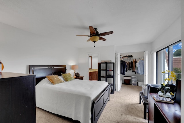 2938 SW 12th St, Deerfield Beach, FL 33442 - bedroom featuring light colored carpet, a closet, ceiling fan, connected bathroom, and a walk in closet