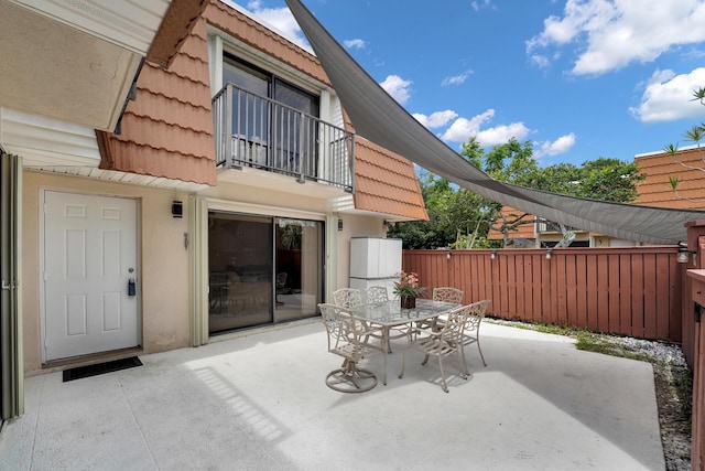 2938 SW 12th St, Deerfield Beach, FL 33442 - view of patio featuring a balcony and outdoor dining area
