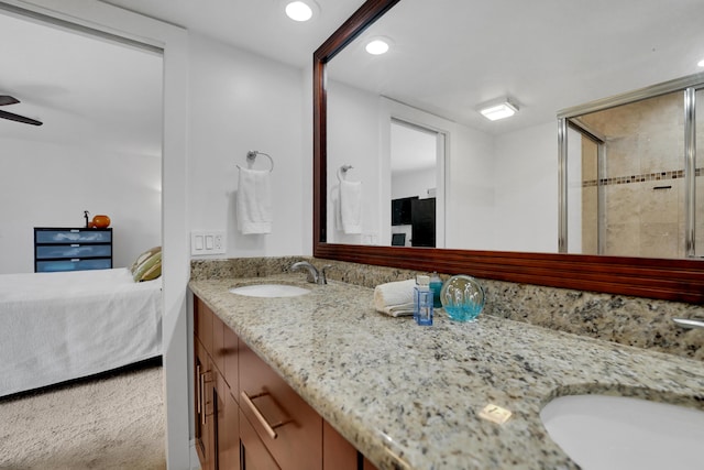 2938 SW 12th St, Deerfield Beach, FL 33442 - ensuite bathroom featuring double vanity, tiled shower, recessed lighting, and a ceiling fan