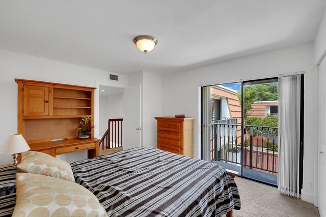 2938 SW 12th St, Deerfield Beach, FL 33442 - bedroom featuring access to exterior and light carpet