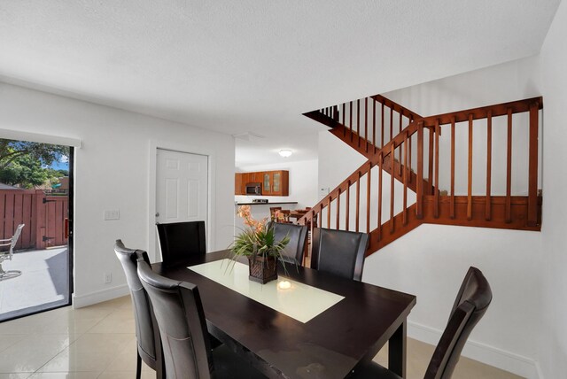 2938 SW 12th St, Deerfield Beach, FL 33442 - dining room with stairs, baseboards, and light tile patterned floors