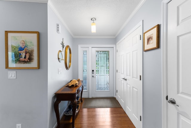 454 Tequesta Dr, Tequesta, FL 33469 - foyer with crown molding, dark wood-style flooring, a textured ceiling, and baseboards