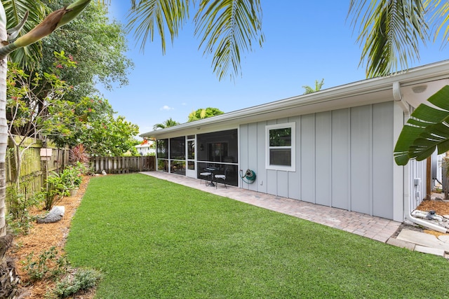454 Tequesta Dr, Tequesta, FL 33469 - view of yard with a sunroom and a patio area