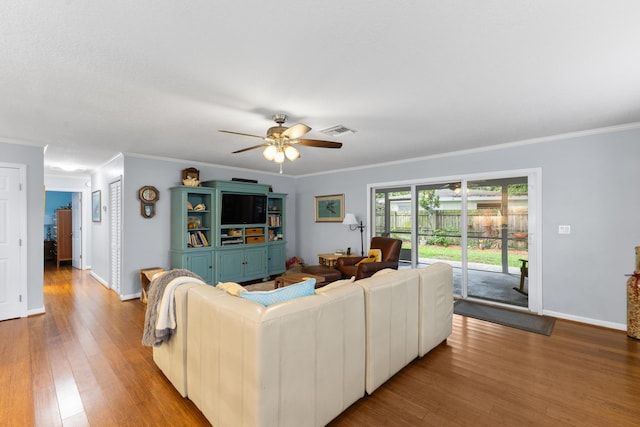 454 Tequesta Dr, Tequesta, FL 33469 - living room featuring wood finished floors, ornamental molding, ceiling fan, and baseboards