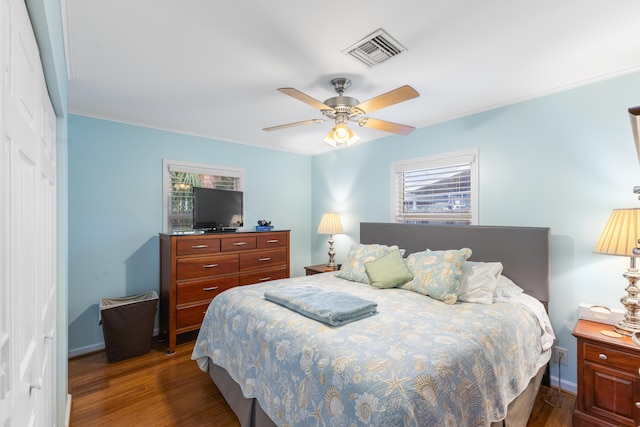 454 Tequesta Dr, Tequesta, FL 33469 - bedroom with dark wood-style flooring, baseboards, a closet, ceiling fan, and ornamental molding