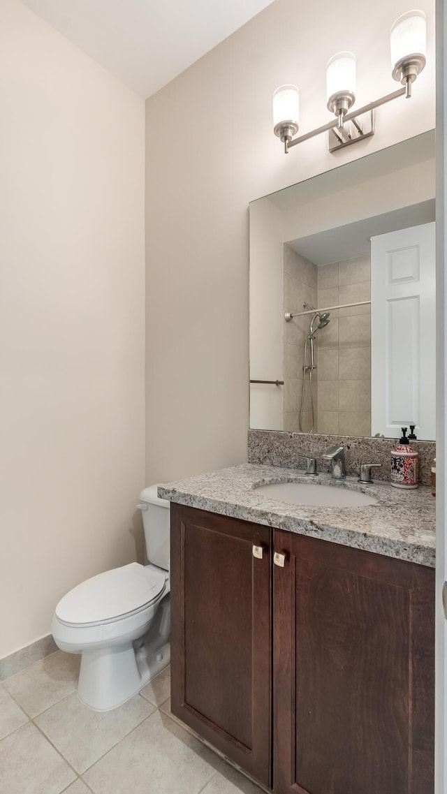 8520 Lewis River Rd, Delray Beach, FL 33446 - full bath with toilet, a tile shower, tile patterned floors, vanity, and baseboards