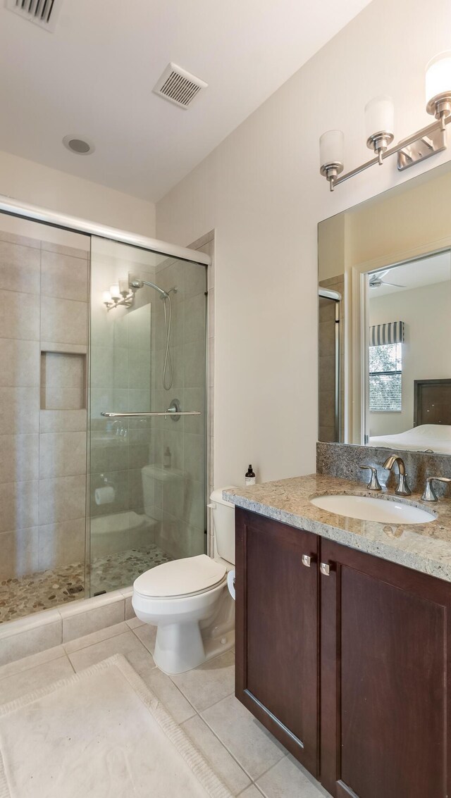 8520 Lewis River Rd, Delray Beach, FL 33446 - full bath with tile patterned floors, a stall shower, toilet, and vanity