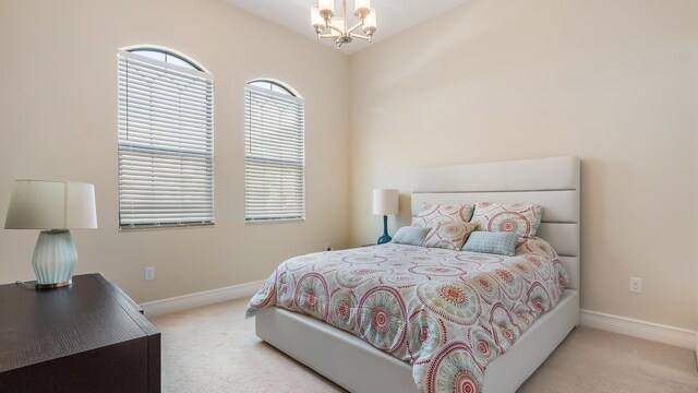 8520 Lewis River Rd, Delray Beach, FL 33446 - bedroom with carpet flooring, a chandelier, baseboards, and lofted ceiling