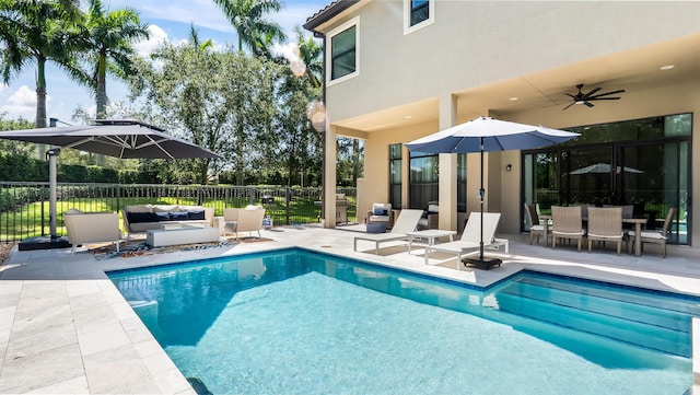 8520 Lewis River Rd, Delray Beach, FL 33446 - view of pool with a patio area, outdoor lounge area, a ceiling fan, and outdoor dining space