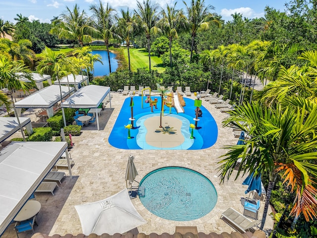 8520 Lewis River Rd, Delray Beach, FL 33446 - view of swimming pool with view of wooded area and a water view