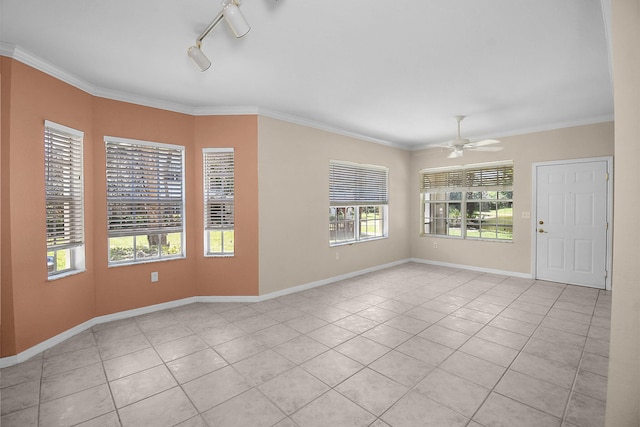 174 SE Kitching Cir Unit 174, Stuart, FL 34994 - spare room featuring light tile patterned flooring, ceiling fan, ornamental molding, and baseboards