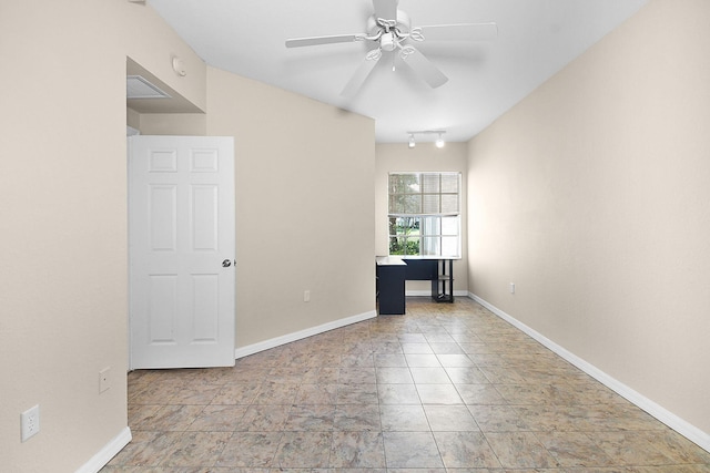 174 SE Kitching Cir Unit 174, Stuart, FL 34994 - unfurnished room featuring ceiling fan, baseboards, and rail lighting