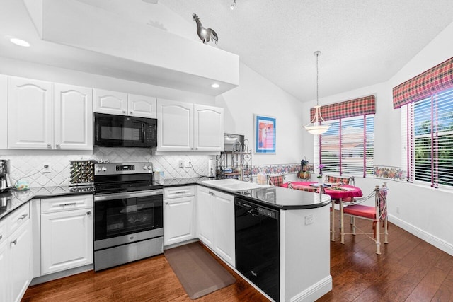 5846 NW 24th Ave Unit 202, Boca Raton, FL 33496 - kitchen featuring black appliances, dark countertops, vaulted ceiling, dark wood-type flooring, and tasteful backsplash