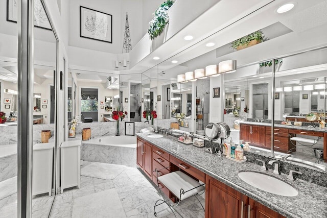 5846 NW 24th Ave Unit 202, Boca Raton, FL 33496 - bathroom with marble finish floors, a bath, double vanity, and recessed lighting