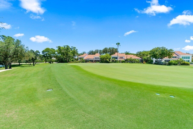5846 NW 24th Ave Unit 202, Boca Raton, FL 33496 - view of property's community featuring view of golf course, a lawn, and a residential view