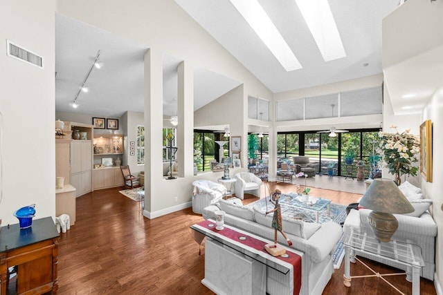 5846 NW 24th Ave Unit 202, Boca Raton, FL 33496 - living area featuring wood finished floors, a skylight, high vaulted ceiling, and baseboards