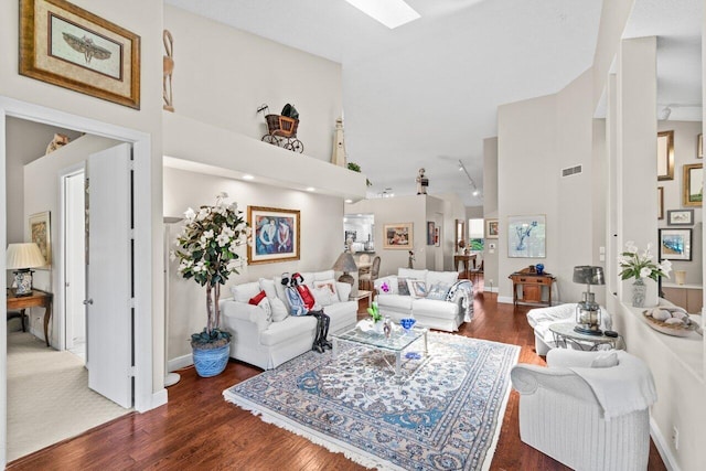 5846 NW 24th Ave Unit 202, Boca Raton, FL 33496 - living room featuring high vaulted ceiling, wood finished floors, a skylight, and baseboards