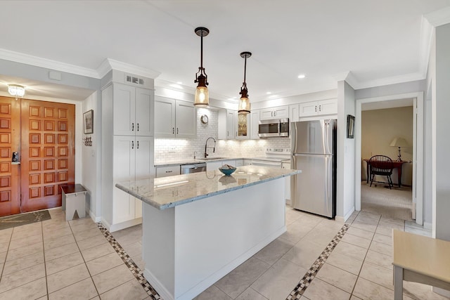 1800 SE Saint Lucie Blvd Unit 2-204, Stuart, FL 34996 - kitchen with appliances with stainless steel finishes, inlaid floor details, a sink, tasteful backsplash, and light stone countertops