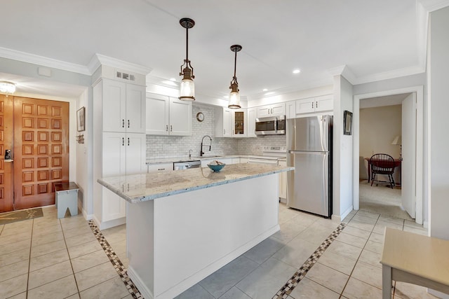 1800 SE Saint Lucie Blvd Unit 2-204, Stuart, FL 34996 - kitchen with stainless steel appliances, inlaid floor details, a sink, white cabinets, and recessed lighting