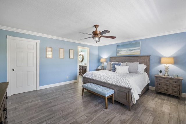 bedroom featuring wood finished floors, baseboards, ornamental molding, a ceiling fan, and ensuite bathroom