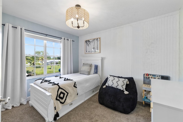 bedroom featuring a chandelier and carpet floors