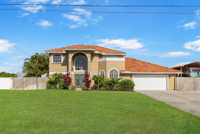 mediterranean / spanish home featuring stucco siding, driveway, a tiled roof, and an attached garage