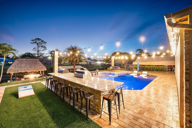 view of pool featuring a gazebo, a lawn, a patio, and a pool with connected hot tub