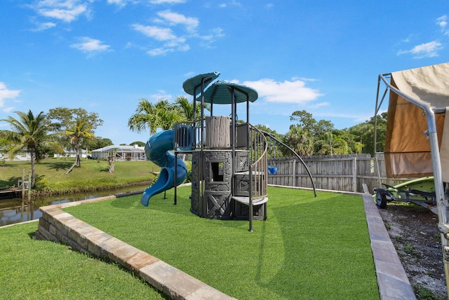 view of jungle gym with a water view