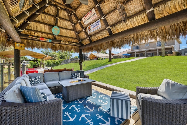 view of patio / terrace featuring a gazebo and an outdoor living space with a fire pit