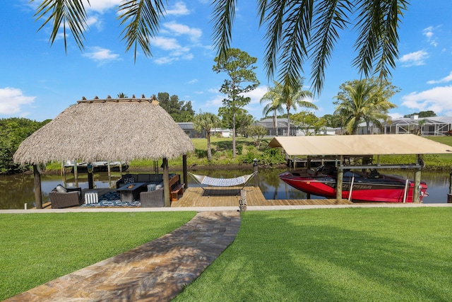 dock featuring a lawn, boat lift, and a water view
