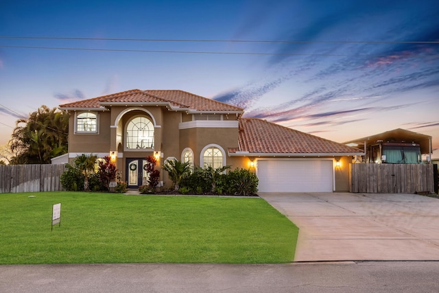 mediterranean / spanish home with a tile roof, stucco siding, an attached garage, and driveway