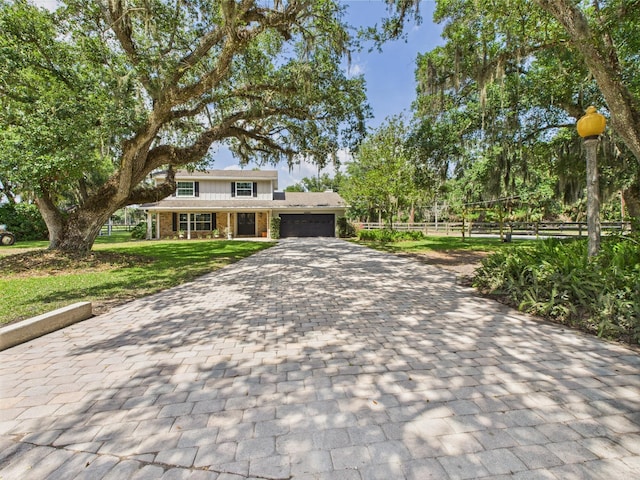 2045 SW 18th Ln, Okeechobee, FL 34974 - view of front of home featuring an attached garage, decorative driveway, and brick siding