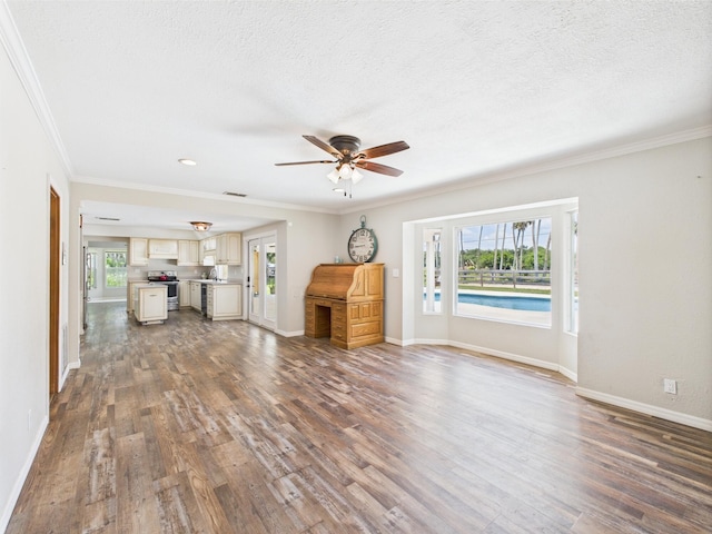 2045 SW 18th Ln, Okeechobee, FL 34974 - unfurnished living room with a ceiling fan, wood finished floors, baseboards, ornamental molding, and a textured ceiling