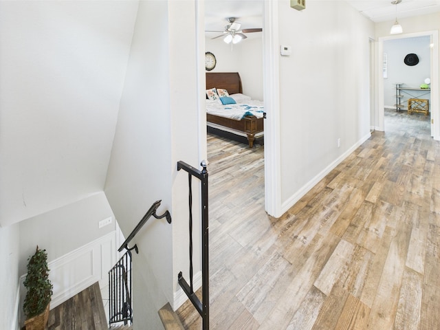 2045 SW 18th Ln, Okeechobee, FL 34974 - hall with an upstairs landing, light wood-style floors, and baseboards