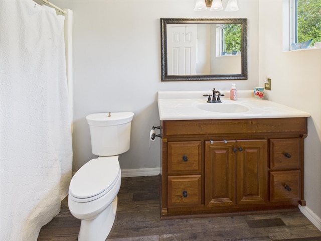 2045 SW 18th Ln, Okeechobee, FL 34974 - bathroom featuring baseboards, plenty of natural light, and wood finished floors