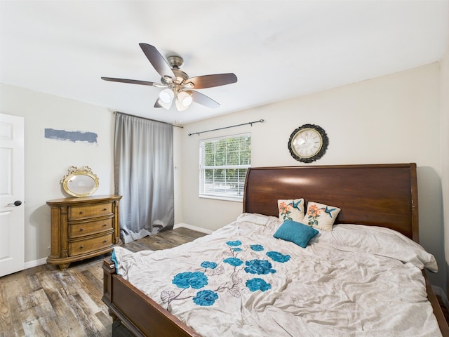 2045 SW 18th Ln, Okeechobee, FL 34974 - bedroom with wood finished floors, baseboards, and ceiling fan