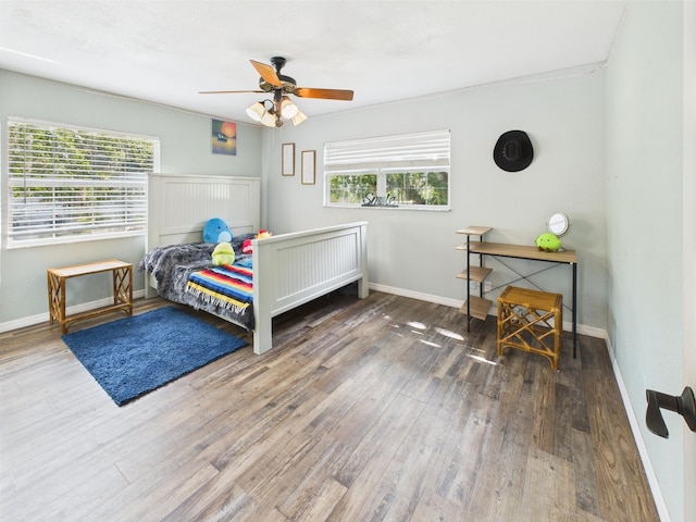 2045 SW 18th Ln, Okeechobee, FL 34974 - bedroom featuring wood finished floors, baseboards, and ceiling fan