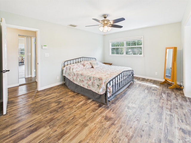 2045 SW 18th Ln, Okeechobee, FL 34974 - bedroom with wood finished floors, baseboards, and ceiling fan