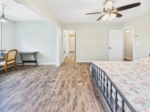 2045 SW 18th Ln, Okeechobee, FL 34974 - bedroom with wood finished floors, baseboards, and ceiling fan