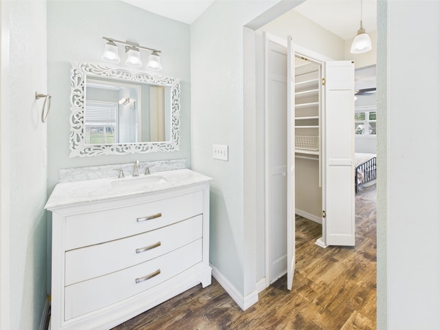 2045 SW 18th Ln, Okeechobee, FL 34974 - bathroom featuring wood finished floors, vanity, and baseboards
