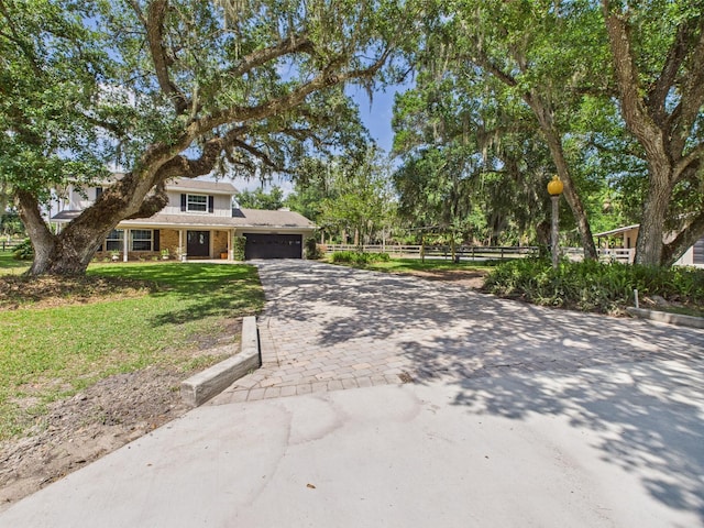 2045 SW 18th Ln, Okeechobee, FL 34974 - view of front facade featuring a garage, decorative driveway, and brick siding