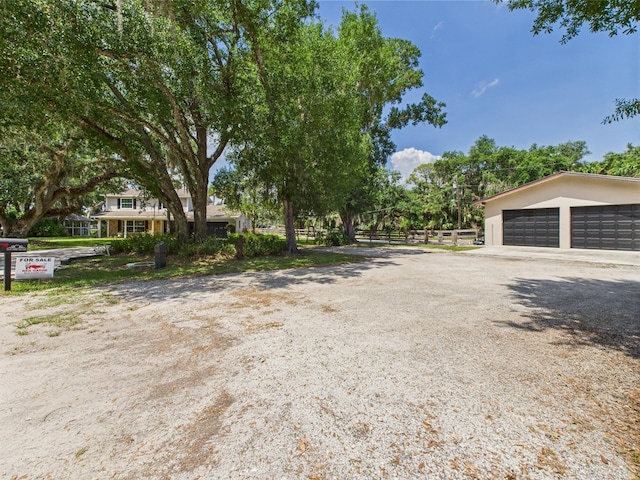2045 SW 18th Ln, Okeechobee, FL 34974 - view of yard featuring a detached garage