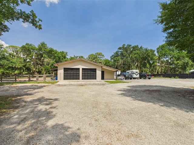 2045 SW 18th Ln, Okeechobee, FL 34974 - view of side of property featuring a detached garage and stucco siding