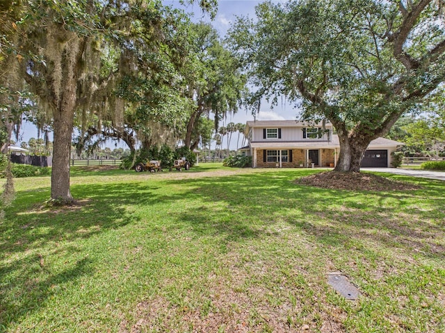 2045 SW 18th Ln, Okeechobee, FL 34974 - view of yard with driveway and an attached garage