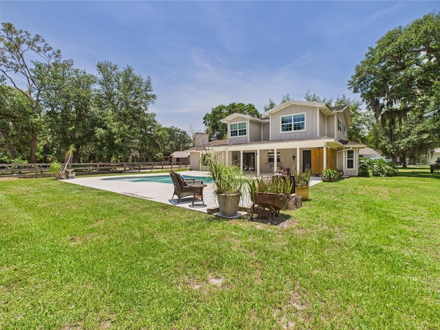 2045 SW 18th Ln, Okeechobee, FL 34974 - back of property with a patio area and board and batten siding
